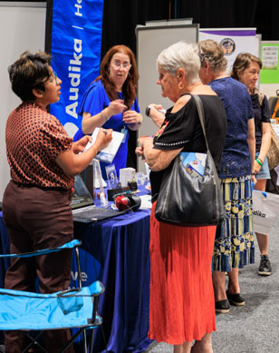 Guests, families and exhibitors at a Disability Expo Australia event