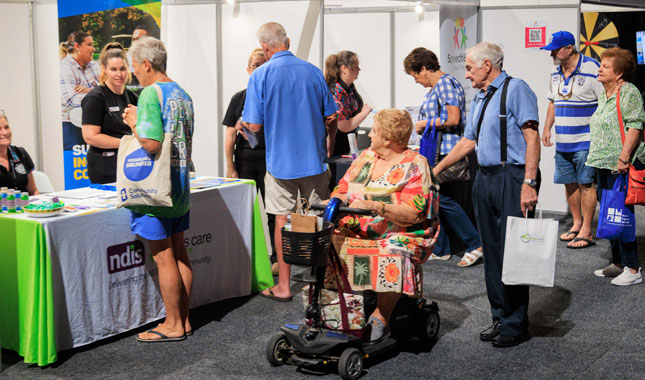 Guests, families and exhibitors at a Disability Expo Australia event